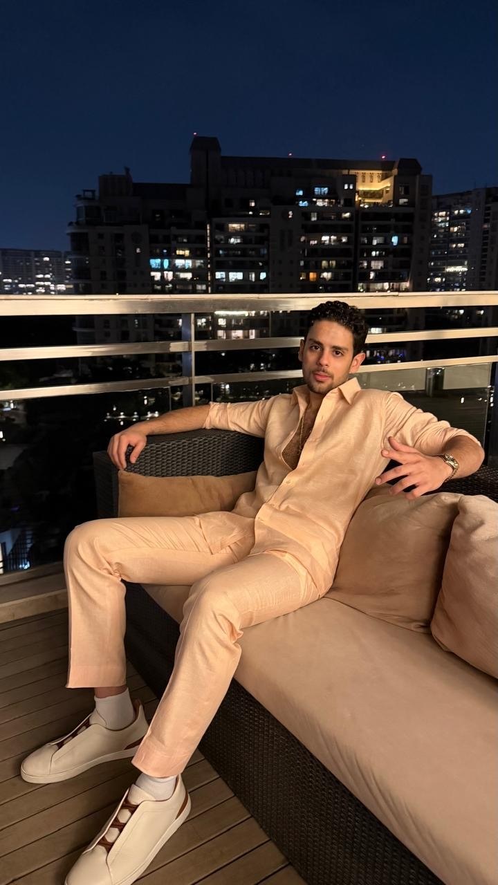 Rocky V. Bawa on a Miami rooftop at night in a tailored linen suit